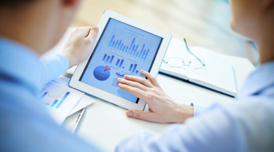 business-people-viewing-chart- on-tablet