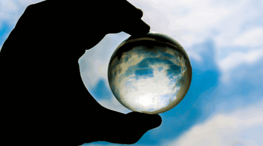 hand-holding-glass-globe